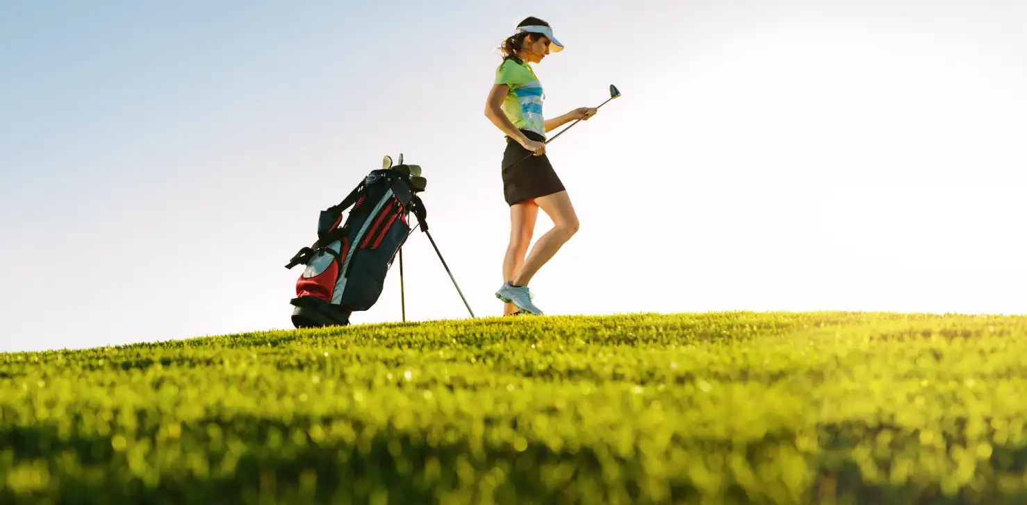 Black and red golf bag with a tripod stand